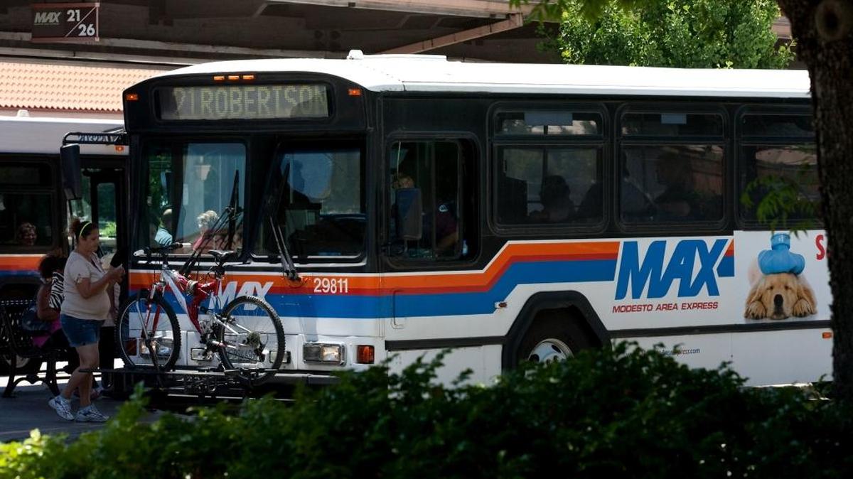 (DARRYL BUSH/dbush@modbee.com) - A Modesto Area Express (MAX) bus waits to load passengers at the Modesto Transportation Center in Modesto, Calif., on Monday, June 13, 2011.