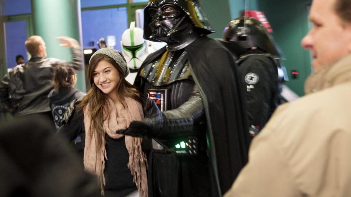 Bailey Fagundes poses with Darth Vader, portrayed by 501st Legion member Steven Gwin, on opening day of the movie “Star Wars: The Force Awakens” at Brenden Theatres on 10th Street in Modesto on Thursday, Dec. 17, 2015.
