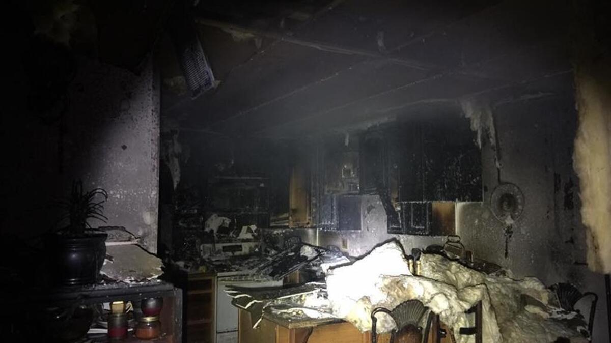 A grease fire was contained to the kitchen of a Modesto home Thursday night, but caused smoke and heat damage throughout.