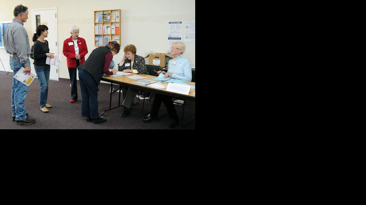 
Voters line up to check in and get their ballots at St. Paul’s Episcopal Church Tuesday in Modesto.
