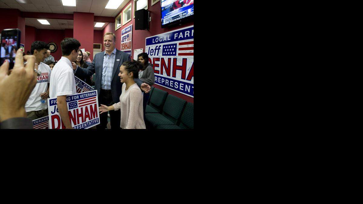 
Rep. Jeff Denham, R-Turlock, celebrates his expected re-election with campaign volunteers Victoria Pulma-Zimmerman, right, and David Levario, left, on Tuesday night in Modesto.
