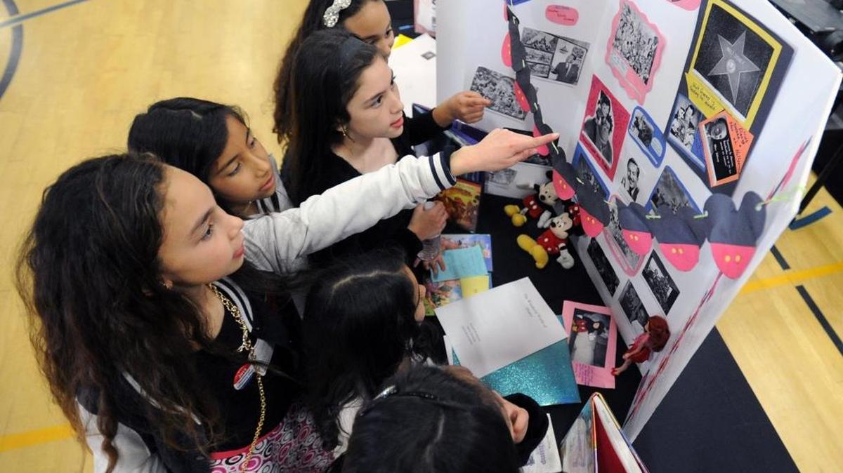Students study an exhibit during National History Day at Creekside Middle School in February in Patterson, part of a districtwide program expanded this year. Schools in the Patterson Joint Unified district will be governed by a new board in December, with the election of at least two board members still unresolved.
