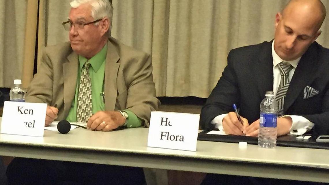 Ken Vogel and Heath Flora participate in a debate March 30, 2016.