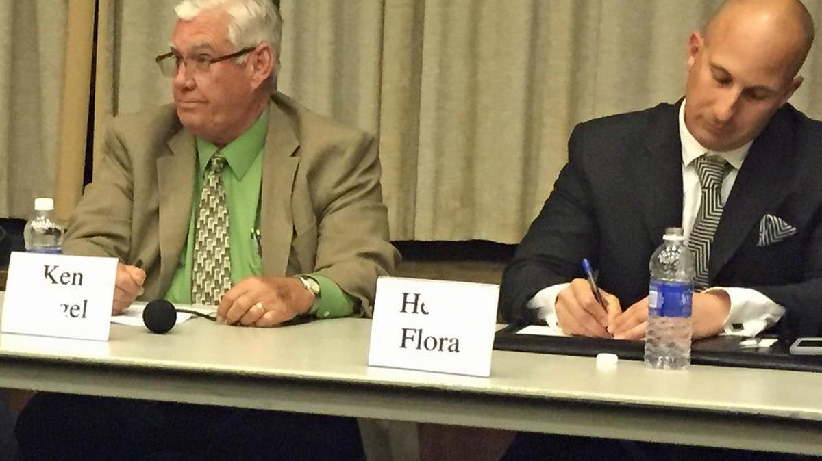 Ken Vogel and Heath Flora participate in a debate March 30, 2016.