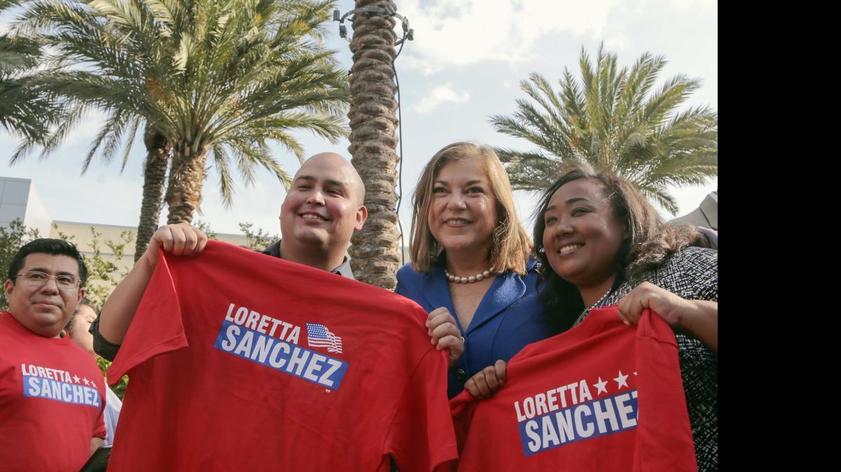 
Rep. Loretta Sanchez, second from right, poses with supporters at the California Democratic Convention in Anaheim on Saturday. The party’s Native American Caucus denounced Sanchez’s caricature of an Indian “war cry” on Monday, calling the gesture she made over the weekend insensitive and insulting.
