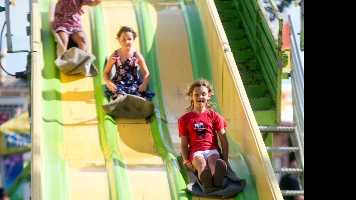 
Emma Kaber goes for a ride July 12 at the fair in Turlock.
