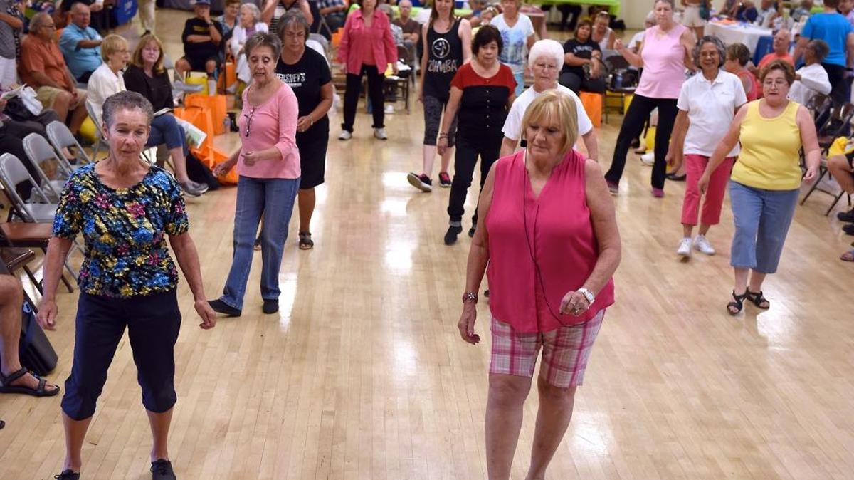 
To celebrate National Senior Center Month, the Modesto Senior Center holds an open house Thursday, Sept. 24, 2015. Nancy Franklin, center, and Linda Sharp, left, give a line dancing demonstration during the event.
