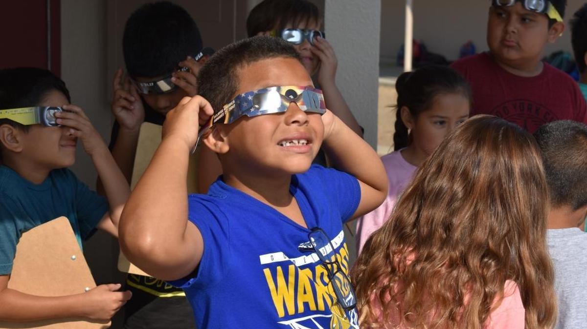 After learning about the eclipse in class, students at Sylvan Elementary School in Modesto stepped outside to view it through special glasses on Monday, Aug. 21, 2017. A partial solar eclipse can be seen in California on Monday, April 8, 2024.
