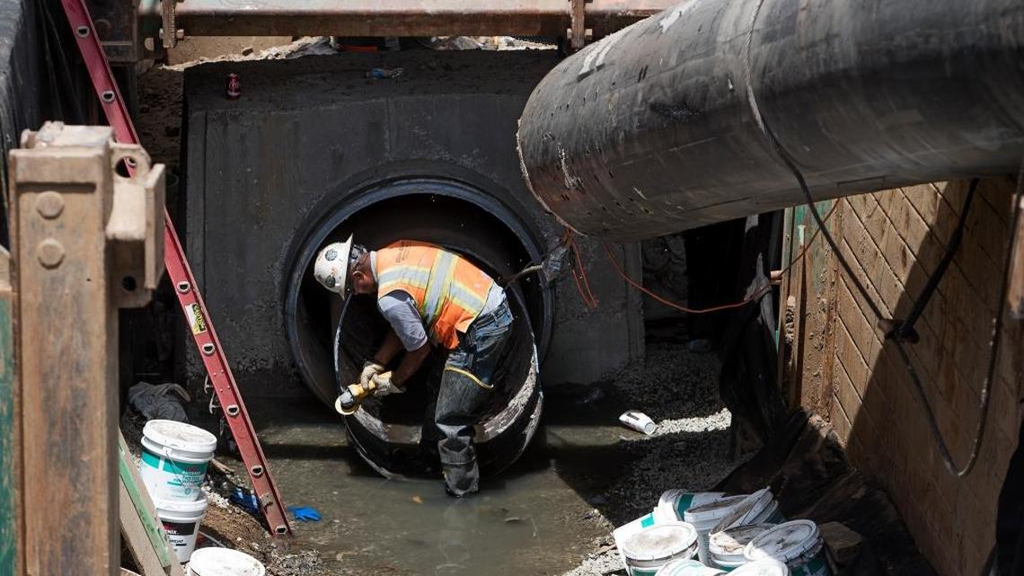 Repairs to the sewer pipeline along the Tuolumne River include threading about 1,100 feet of plastic pipe.