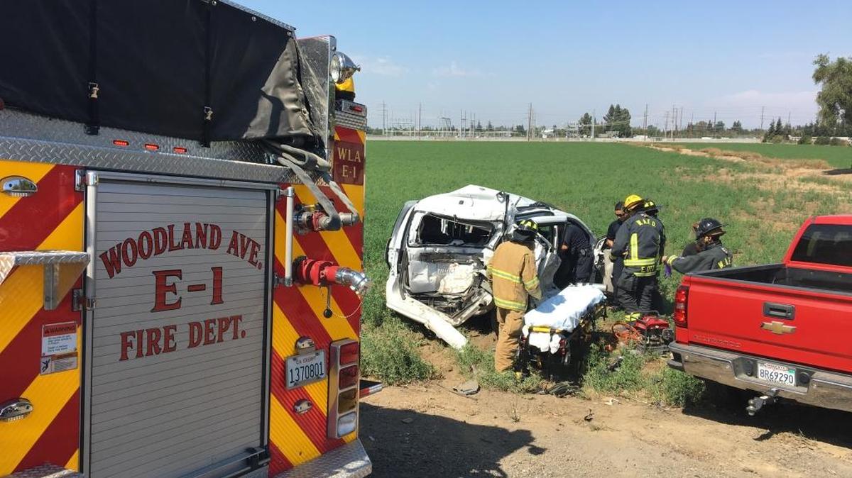 Firefighters help a passenger injured in a multiple-vehicle crash on Highway 132 near Modesto Tuesday afternoon.