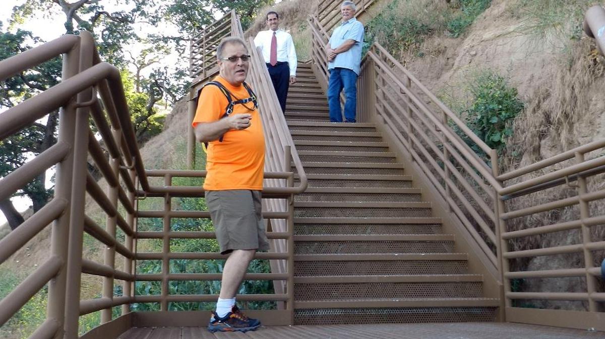 Kevin Hook of Waterford, left, walks up a 150-foot staircase that is part of the city’s portion of the Tuolumne River Parkway in May. Watching him are Waterford City Manager Tim Ogden and Mayor Michael Van Winkle. The new riverside park has won an Award of Excellence from the California Park & Recreation Society.