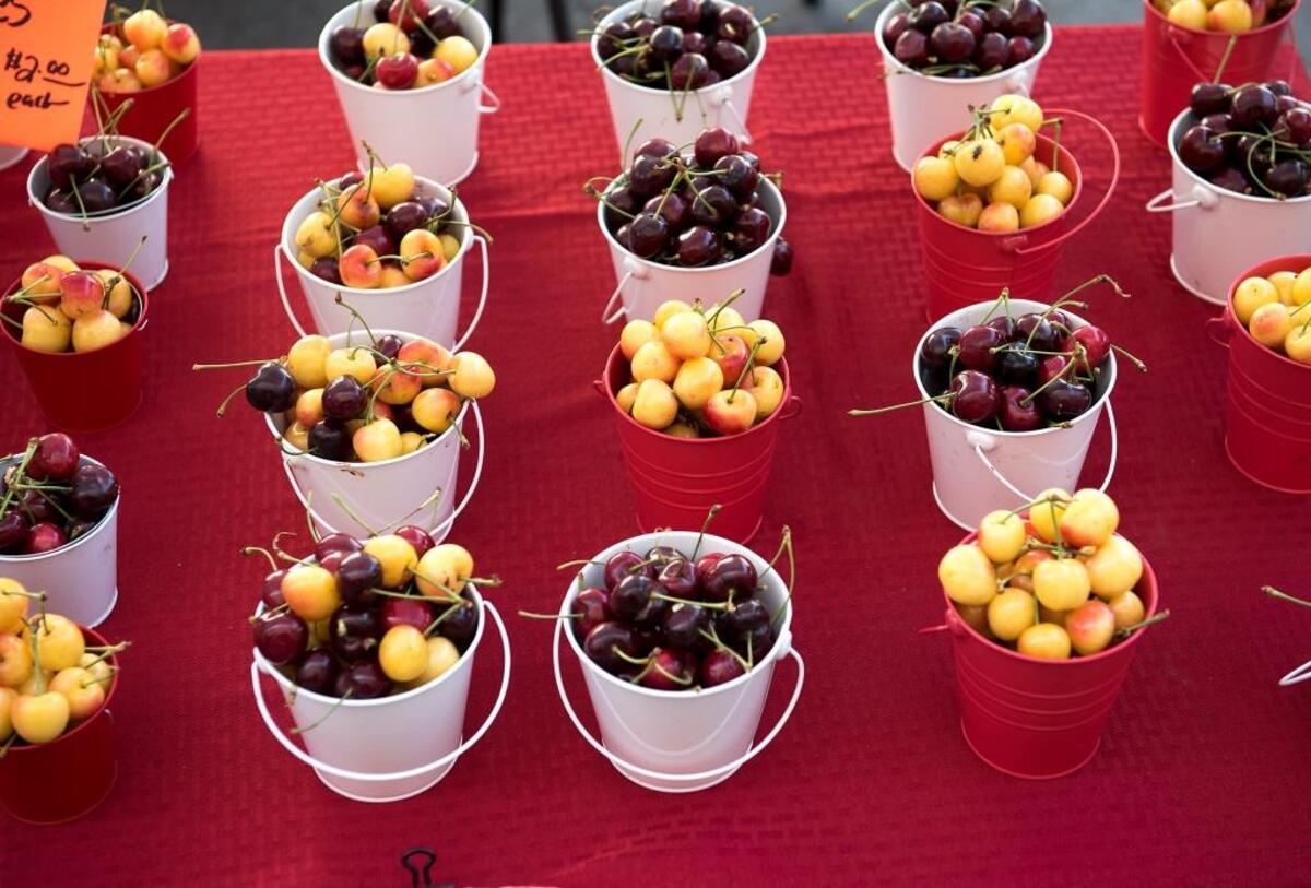Fresh-picked cherries are for sale at the evening farmers market on 10th Street in Modesto on Thursday, June 2, 2016.