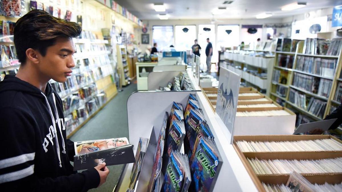 Blaze Ho’ Omakoa, 17, looks at comics at Bonanza Books and Comics in Modesto, Calif., on Saturday, Dec. 5, 2017.