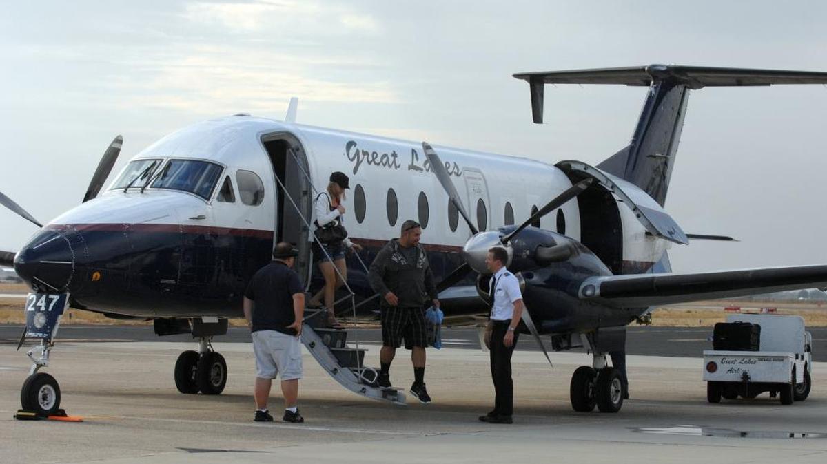 Passengers exit a Great Lakes Airlines plane at Merced Regional Airport in 2010. Modesto officials are in preliminary discussions with Great Lakes about offering commercial passenger flights at Modesto Airport.