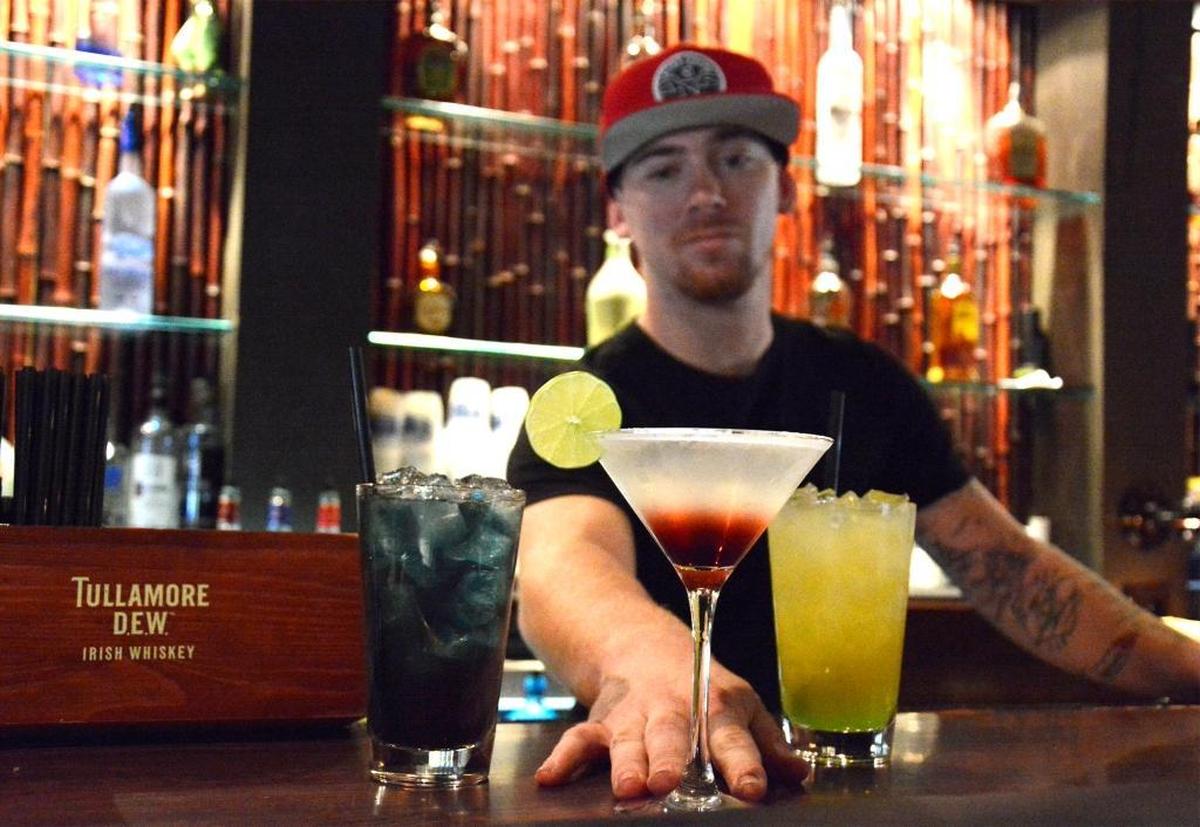 Tiki Cocktail Lounge bartender Dillen Sweeten serves up a variety of mixed drinks at the McHenry Avenue bar on (09-20-17). The establishment opened in 1964 and has been a local favorite ever since.