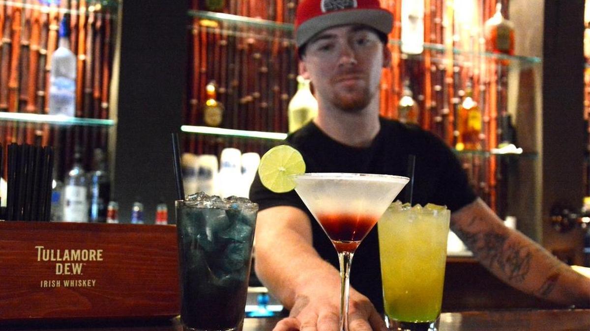 Tiki Cocktail Lounge bartender Dillen Sweeten serves up a variety of mixed drinks at the McHenry Avenue bar in September 2017. The establishment opened in 1964 and had been a local favorite ever since.