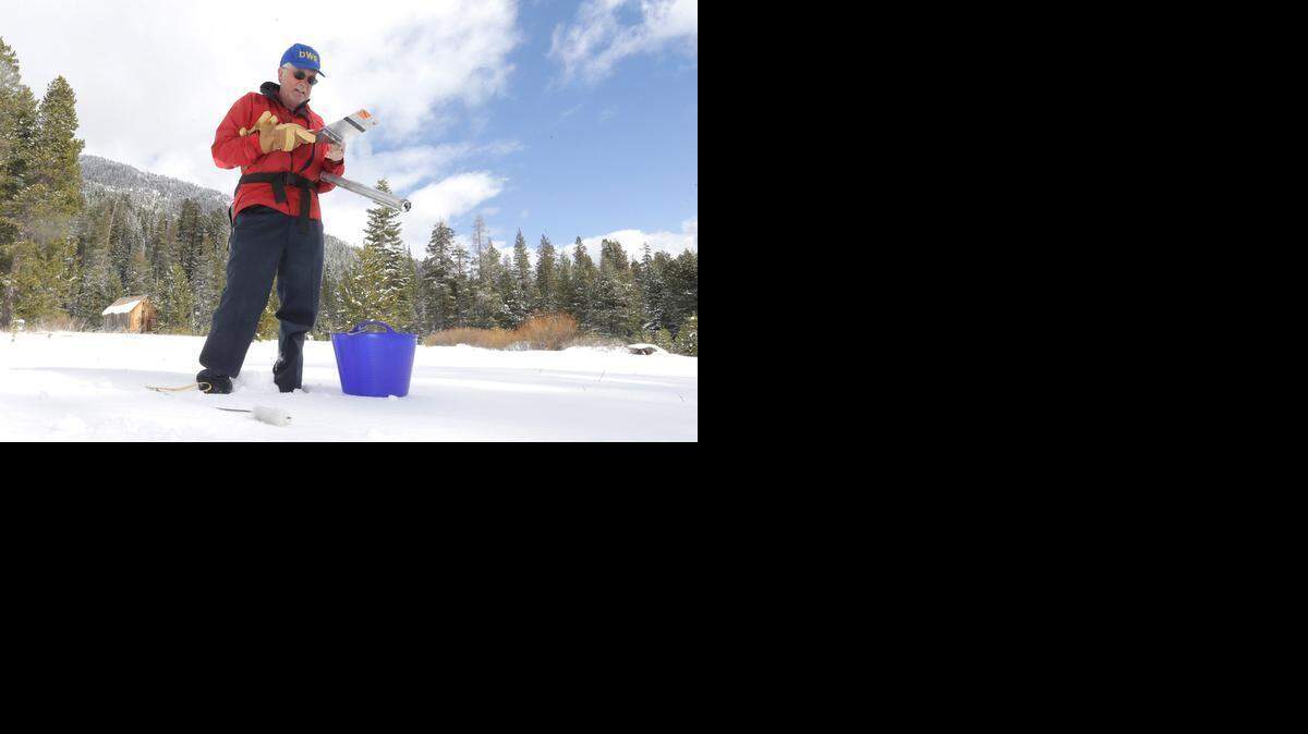 
Frank Gehrke, chief of the California Cooperative Snow Surveys Program for the Department of Water Resources, records the results of the third snow survey of the season held Tuesday near Echo Summit. Gehrke said the snow was 6.7 inches at the survey spot, with a water equivalent of 0.9 inches. On Jan. 29, the water equivalent at the same spot was 2.3 inches, he said. 
