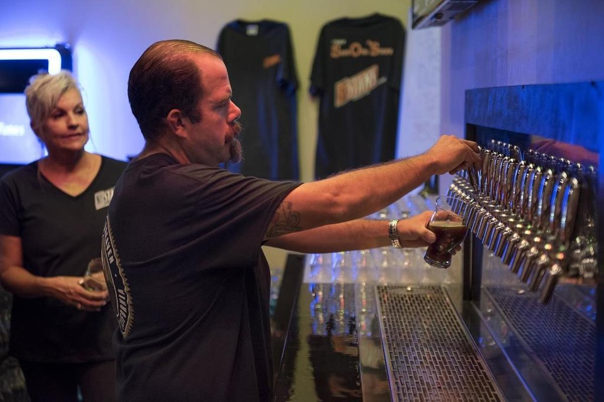 Gus Wagner pours a beer at St. Stan’s Brewery in Modesto, Calif., on Thursday, September 14, 2017.