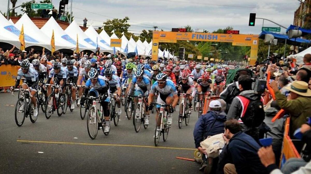 Amgen Tour of California riders enter downtown Modesto as part of finishing stage 3 of the May 2011 race. The city is expected to announce Wednesday that the tour is returning in May 2017.