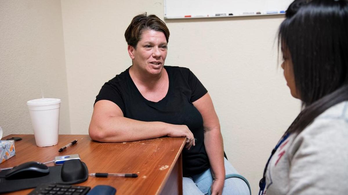 Randee Miller of Modesto talks with counselor Frances R. at the Aegis clinic in Modesto, Calif., on Friday, Oct. 6, 2017.