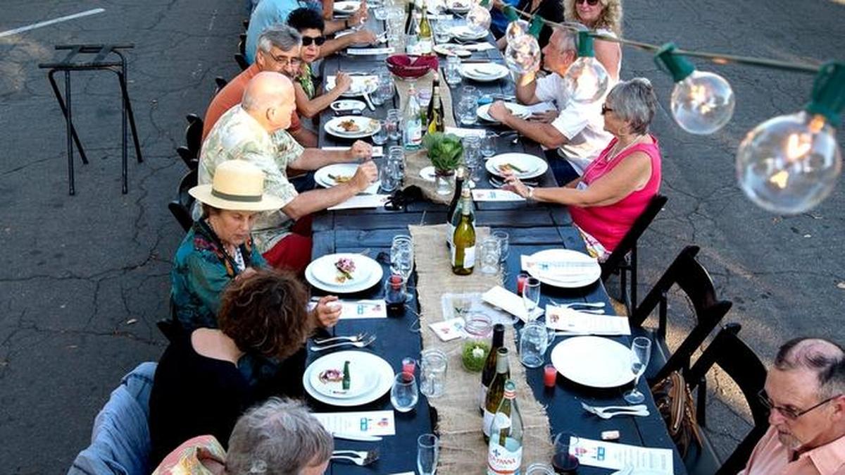 The OneTable dinner party benefited the United Way of Stanislaus County’s Graduation Coach program in Modesto, Calif., last June, when 200 people ate together on a long table on 15th Street. This year’s dinner will be May 15 and this time 300 guests have been invited.