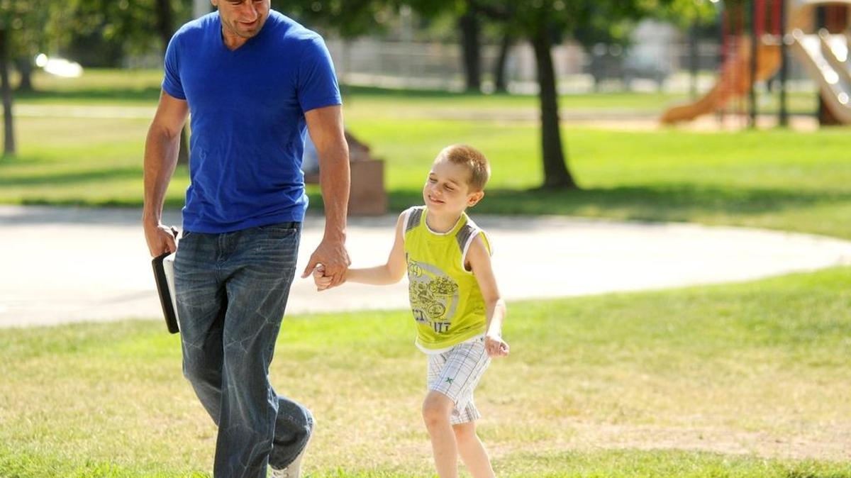 
Modesto resident Jason David walks with son Jayden, then 5, after playing in a neighborhood park in 2013. Jayden could not walk, run, play or eat by himself before being treated with a form of medicinal cannabis, his father said.
