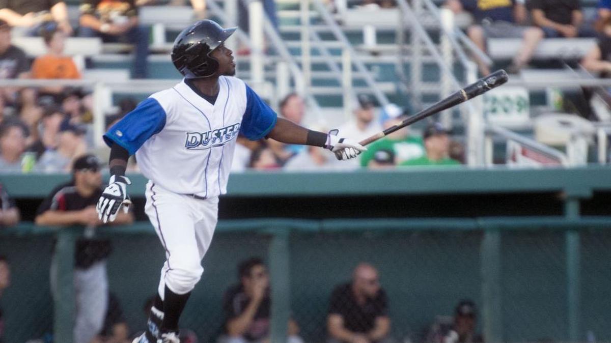 
On July 18, Nuts designated hitter Wilson Soriano watches a deep fly ball during a game between the Modesto Nuts and the Lake Elsinore Storm on “Turn Back the Clock Night” with the Nuts wearing the Dusters jerseys.
