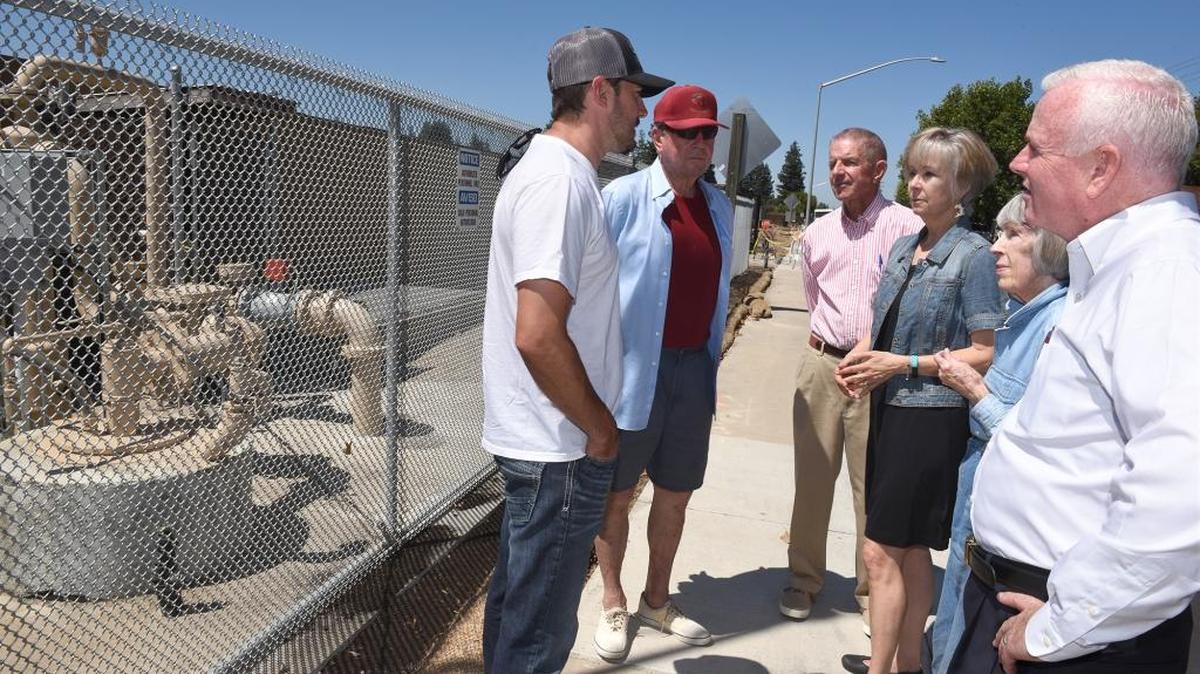 Del Rio board members – from left, John Vargas, Joe Bene, Bill Reinheimer, Joyce Parker, Ila Reinheimer and Bret de St. Jeor – gather Monday near an older well in Del Rio.