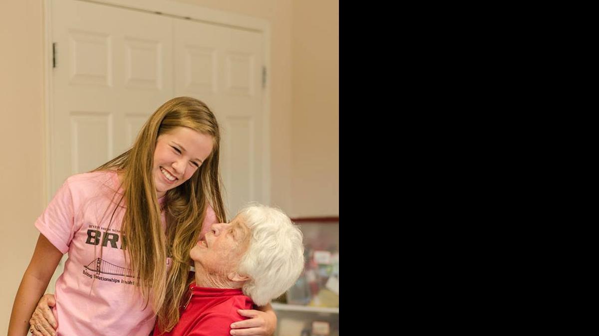 
Girl Scout Meghan McKenzie of Riverbank shares a moment with Barbara Stelle. Meghan founded at her school a club called B.R.I.D.Ge – Building Relationships Involving Diverse Generations. The club includes about 15 students, who walk to a local assisted-living community once a month to spend time with the residents. They play games, do crafts, and simply spend time and create friendships with the people there.
