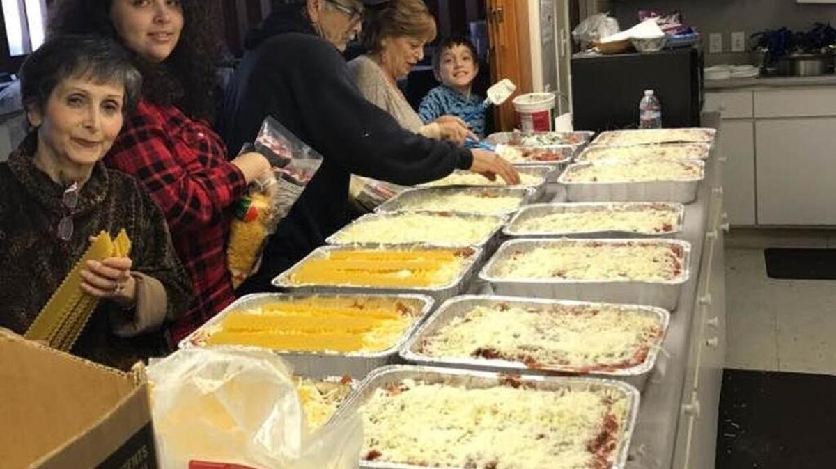 Preparing lasagna at Congregation Beth Shalom in Modesto are, from left, Jeanette Rosenthal and granddaughter Ariel Rosenthal, Tom Gough, Barbara Steel and Gough’s grandnephew Alon Johnson.
