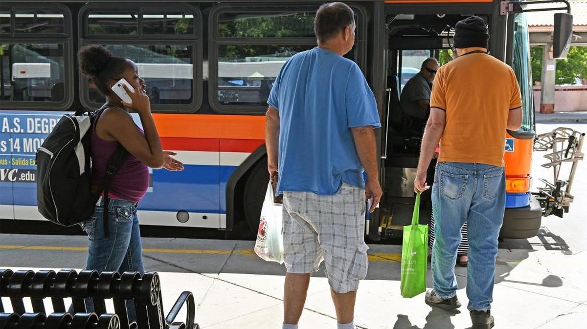 Riders board a MAX bus at the Transportation Center Monday afternoon (06-12-17) in downtown Modesto, Calif. The Modesto City Council committee meets Wednesday to hear a proposal to raise bus fares and change routes as the city tries to meet revenue threshold for its transit system.