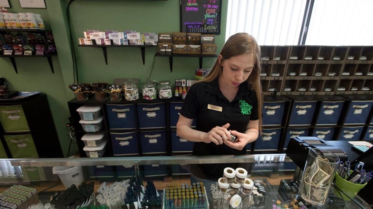 Specialist Rachael Garner shows samples of cannabis products at The Peoples's Remedy in Modesto, Calif., on Wednesday, May 31, 2017.