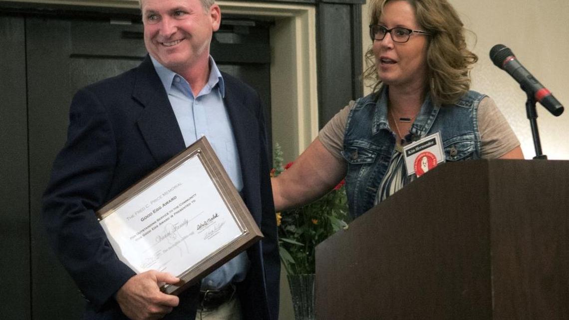 Tony Varni (left) accepts the Good Egg Award on behalf of the Varni Brothers Corporation during the 53 annual Good Egg Breakfast in downtown Modesto California at the Double Tree Hotel on October 22, 2015.