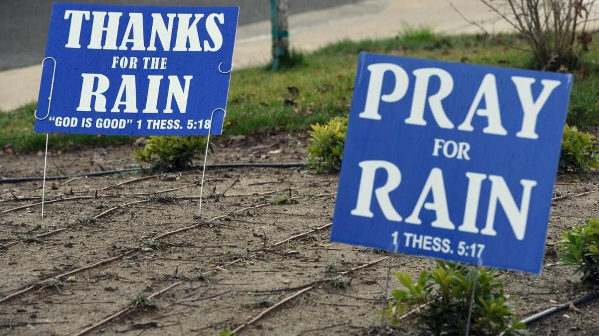 A Thanks for Rain sign is pictured near a Pray for Rain sign on Tuesday, Jan. 2, 2016, on Merle Avenue in Modesto.