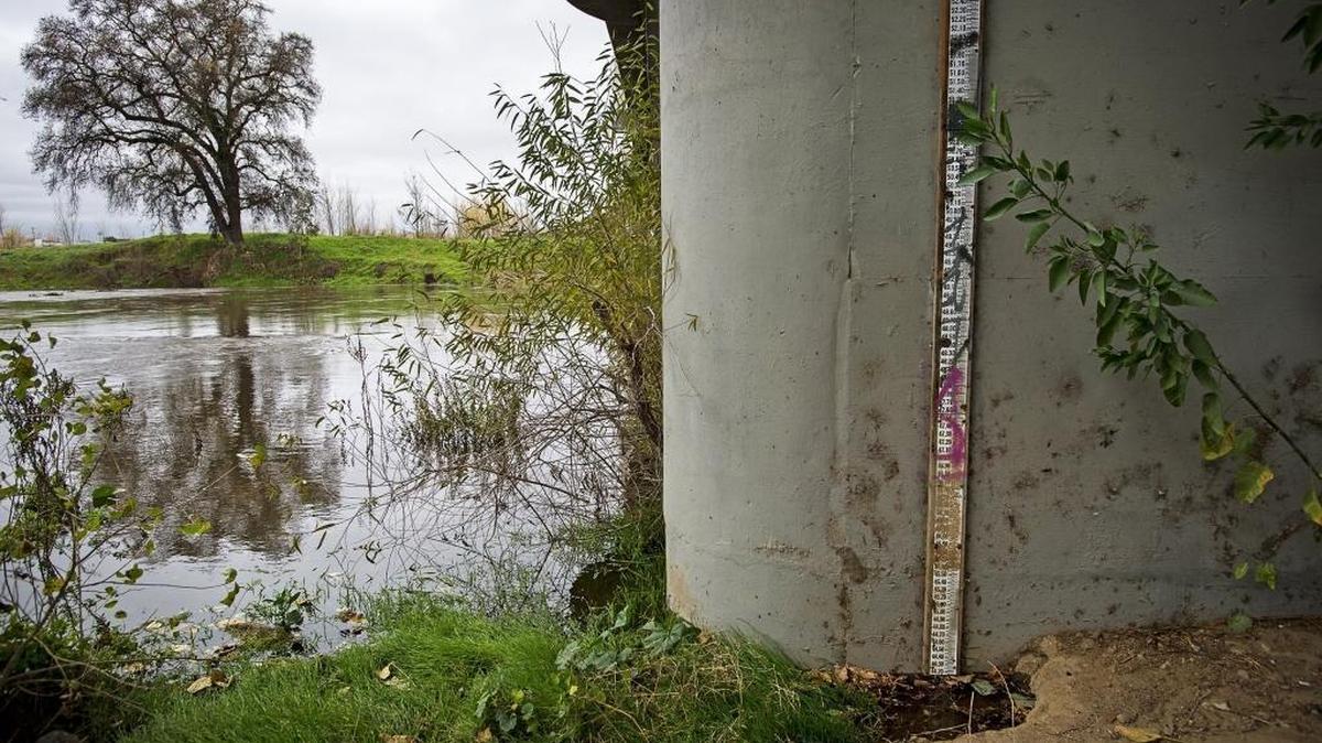 Water has begun to touch the water gauge on Tuolumne River at the Ninth Street Bridge in Modesto, Calif., on Wednesday, Jan. 4, 2017.