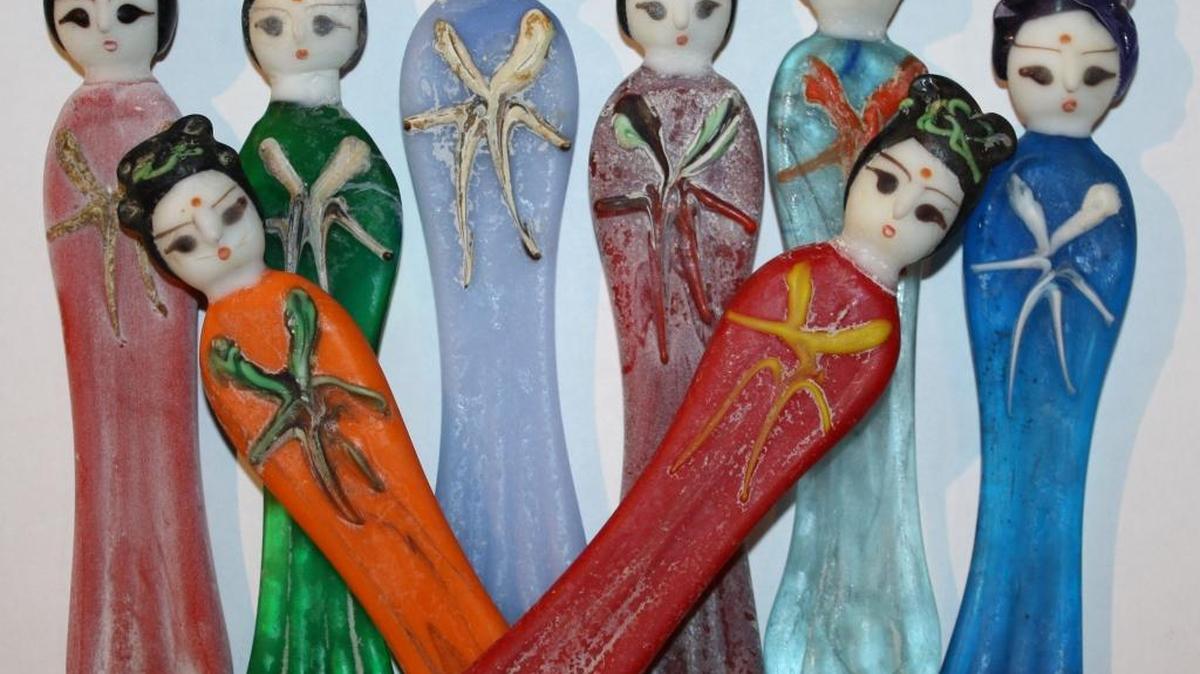 Glass Chinese lady thread winders from Crow Trading Co. are perfect for the hard-to-buy-for collector on your list.