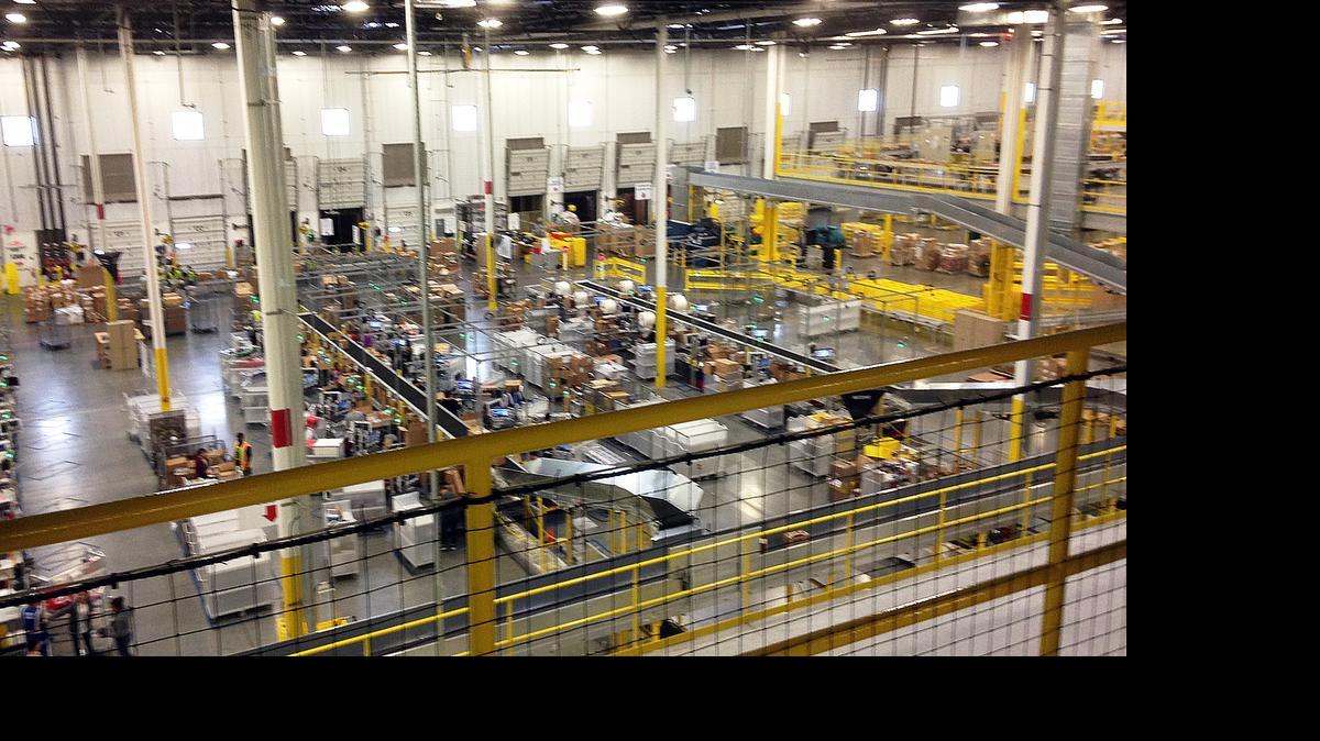 
One of Amazon's newest distribution centers in Tracy, Calif., is seen during a tour Sunday, Nov. 30, 2014. This Amazon Fulfillment Center opened in 2013 and was refitted to use new robot technology in the summer of 2014. (AP Photo/Brandon Bailey) 
