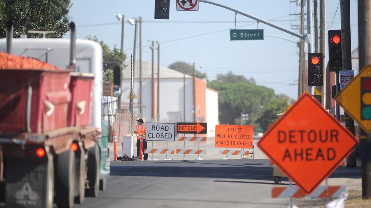 A truck hauling tomatoes approaches 11th and D streets during processing season at Stanislaus Food Products near downtown Modesto.