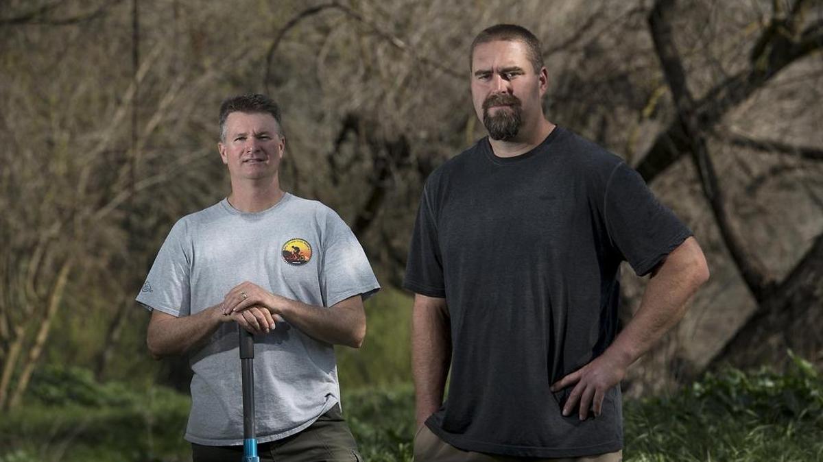 Darin Jesberg, left, and Chris Guptill stand in a cleaned-up section of the Tuolumne River parkway in Modesto on Wednesday, Feb. 24, 2016. The two were recognized by the California State Parks & Recreation Society for their volunteer cleanup efforts along the river.