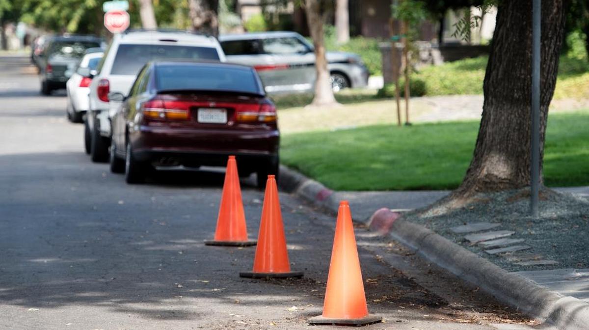 
Some residents on Myrtle Avenue are using cones to reserve parking spots on the street which is also used by students at Modesto Junior College in Modesto, Calif., on Wednesday, October, 14, 2015.
