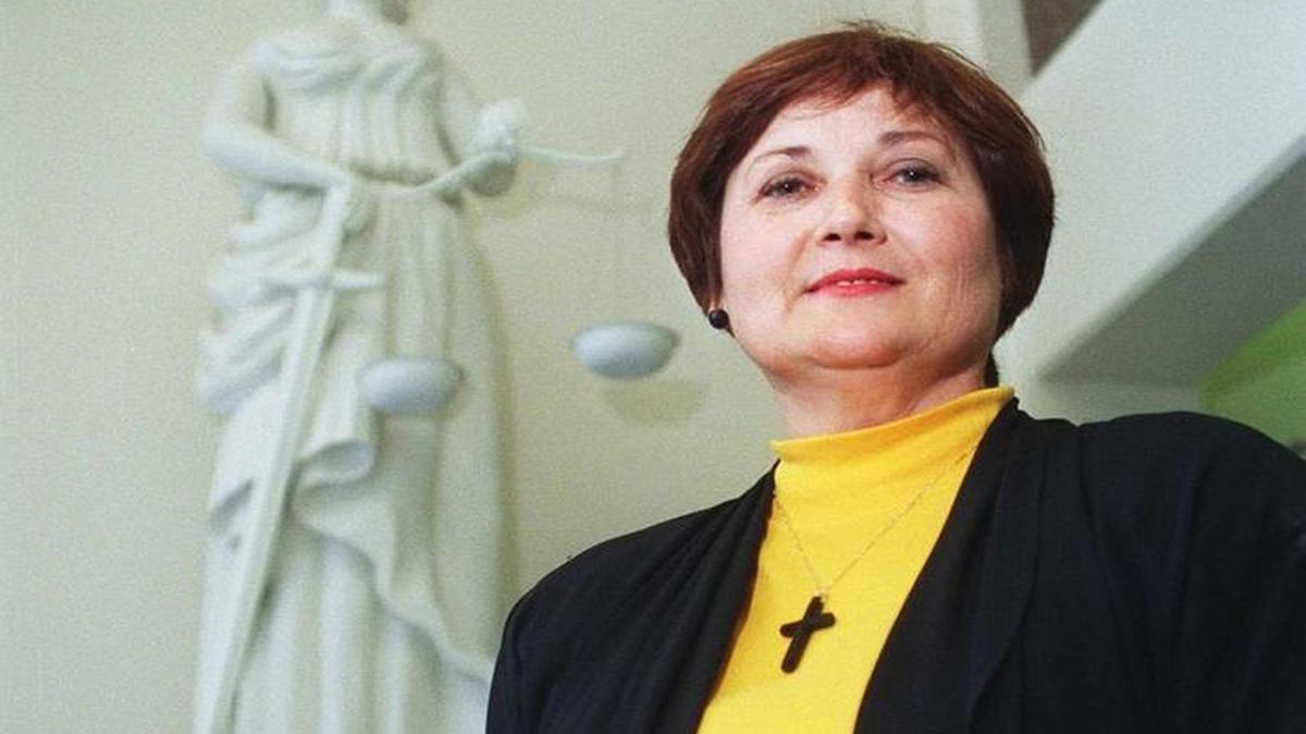 Stanislaus county Clerk-Recorder Karen Mathews stands by the statue of Justice at the Stanislaus County Courthouse in 1997.