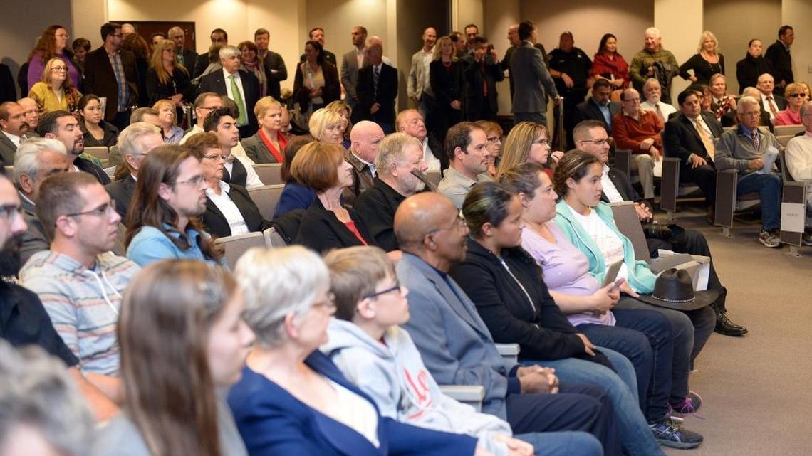 It was standing room only as the audience listens to statements read by outgoing council members Tuesday evening (11-24-15) during a city council meeting in the basement chambers at Tenth Street Place in downtown, Modesto, Calif.