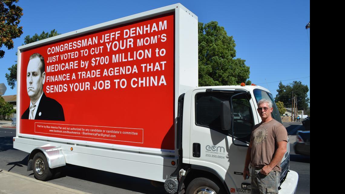 
Modesto driver Greg Johnson says interest is high in the signboard truck he’s been hired to drive on a five-day tour of Stanislaus, Merced, Madera and Fresno counties, protesting the votes of two area congressmen in helping pass the Trade Promotion Authority bill, taken Monday on H Street in downtown Modesto.
