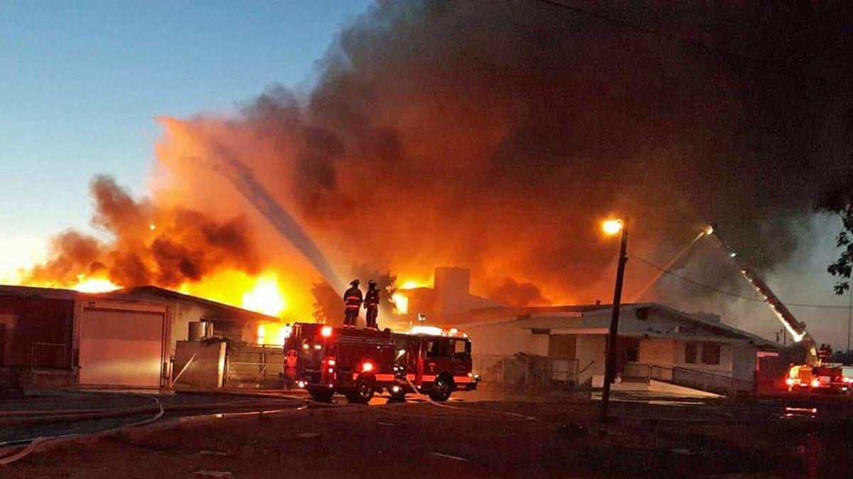 Several fire agencies fought a blaze at the old Patterson hospital on E and 9th streets in Patterson, Calif., on Tuesday, July 5, 2016.