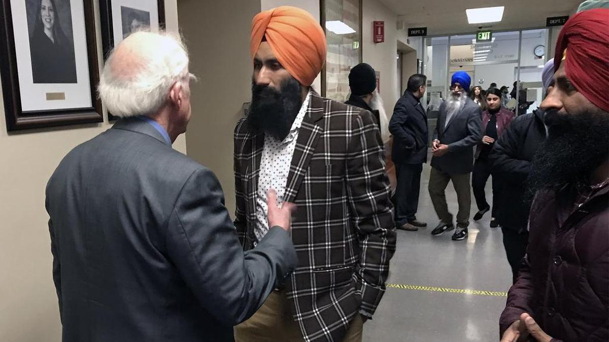 Sandeep Singh, right, speaks with his attorney, Kirk McAllister, moments after his hearing in Stanislaus Superior Court. All charges were dropped against Singh when authorities determined the young girl who accused him had made up the crime.