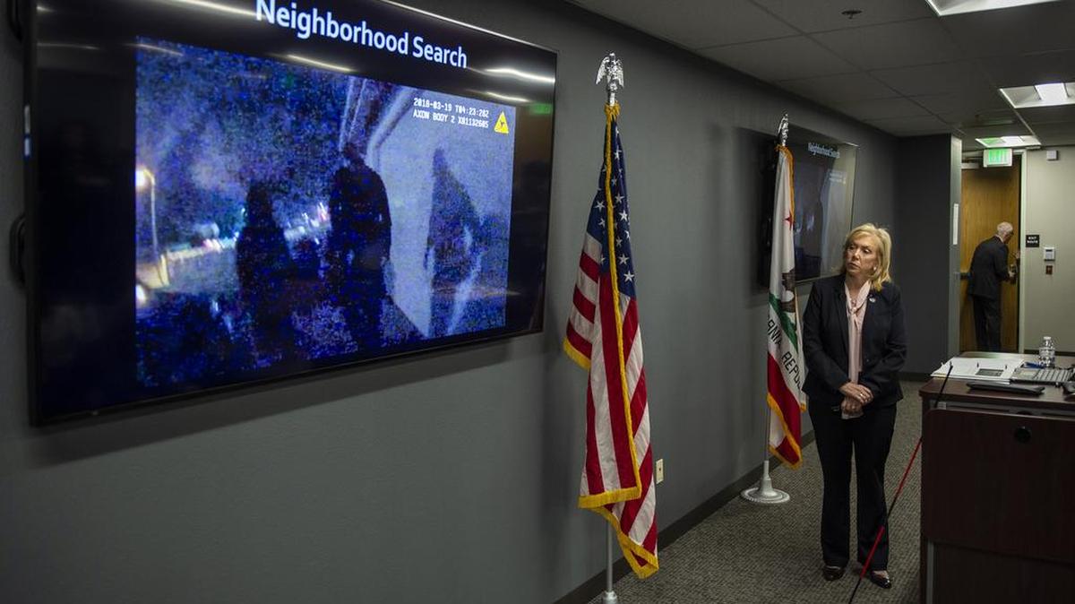 Sacramento County District Attorney Anne Marie Schubert, stands while a police officer body camera video is played during a press conference regarding the Stephon Clark shooting investigation in Sacramento on Saturday.