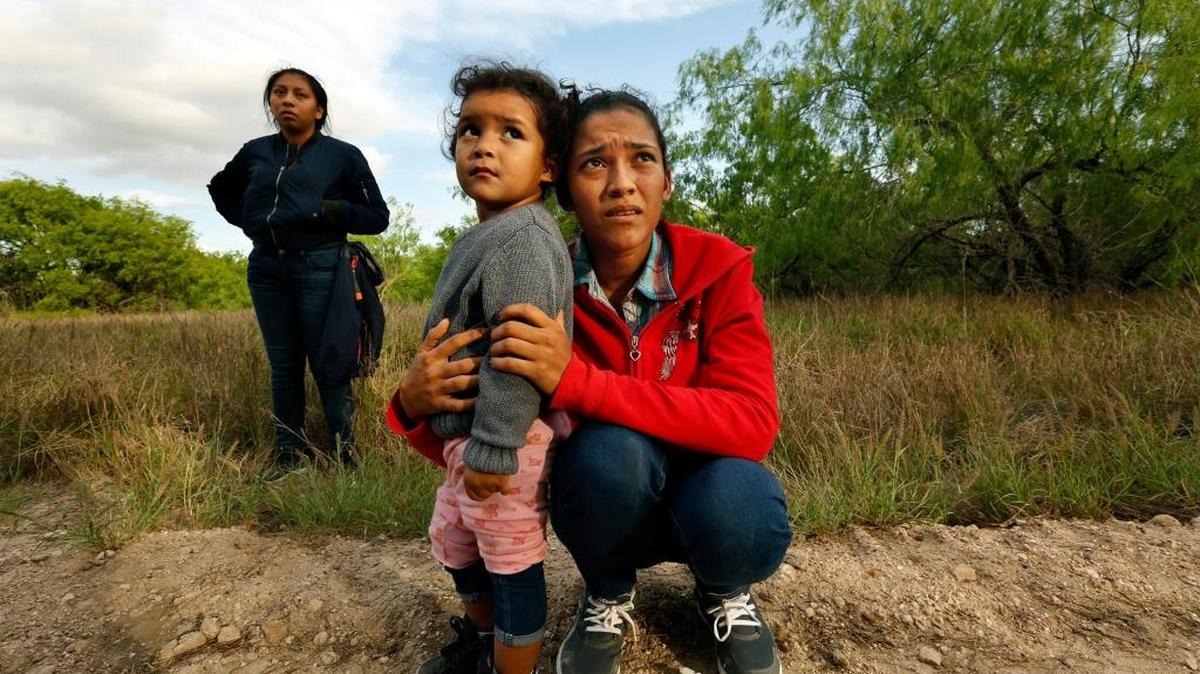Lirio Funes, 20, holds onto her daughter Melissa, 2, just after being detained after crossing the U.S.-Mexico border on March 15.