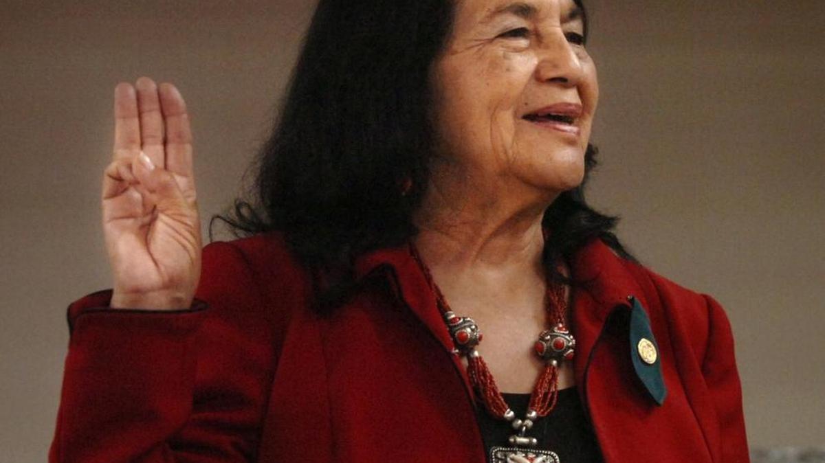 Dolores Huerta, United Farm Workers co-founder, recites the Girl Scout Promise during a ceremony to unveil a patch in her honor at the Girl Scouts Heart of Central California Modesto office in 2008.