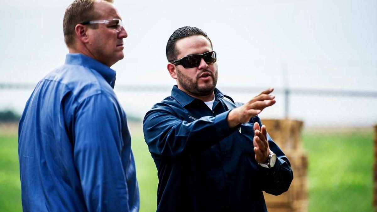 Rep. Jeff Denham, R-Turlock, on the left, speaks to Juan Esquivez, an employee of Westside Pallet Inc., in Newman in 2015. Denham wants to make it easier for small businesses and individuals to file their taxes.