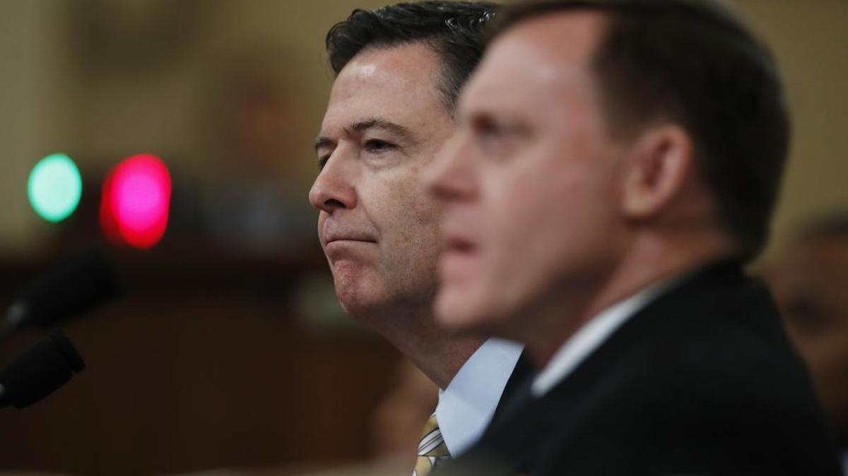 FBI Director James B. Comey, left, joined by National Security Agency Director Michael Rogers, testifies on Capitol Hill on Monday before the House Intelligence Committee hearing on allegations of Russian interference in the 2016 U.S. presidential election.